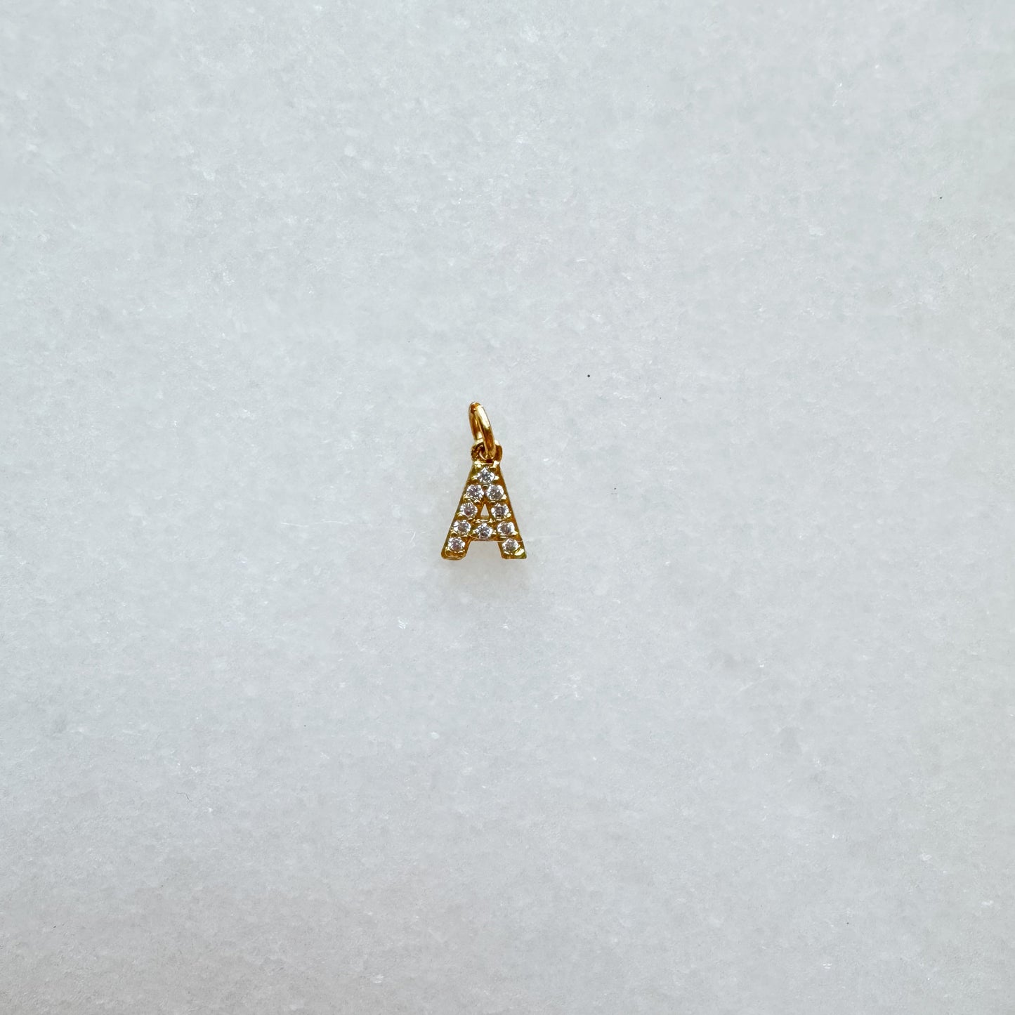 Diamond pavé initial charm set in gold, letter A