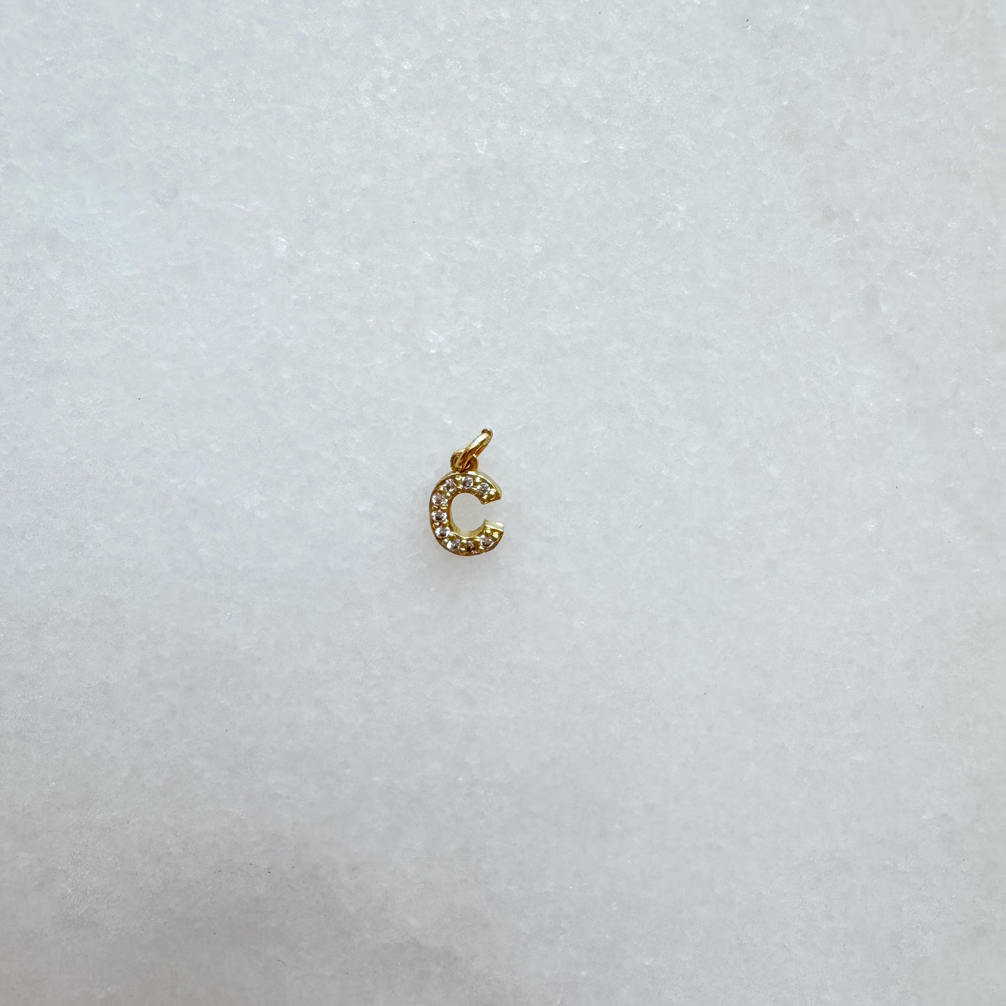 Diamond pavé initial charm set in gold, letter C