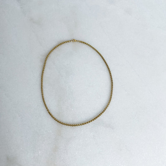 3mm 18K gold-plated Franco chain on marble background