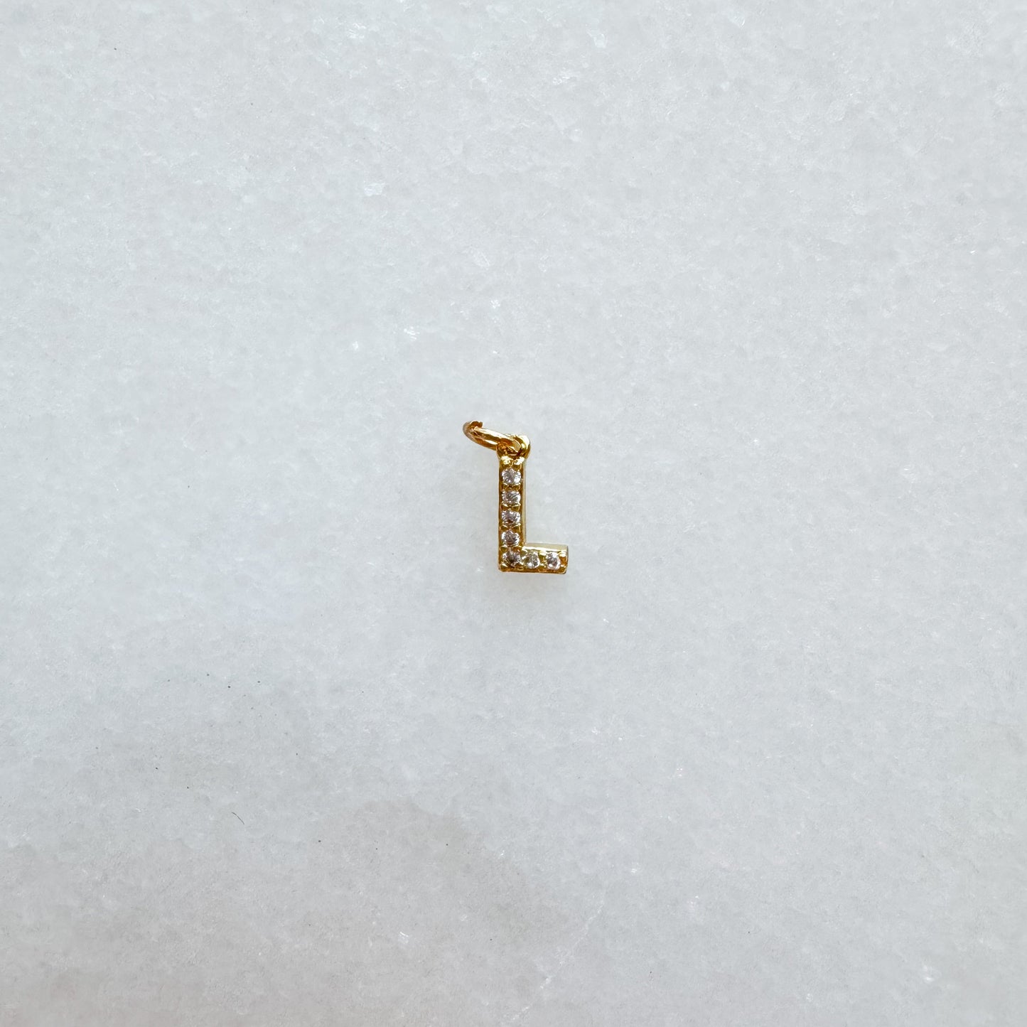 Diamond pavé initial charm set in gold, letter L