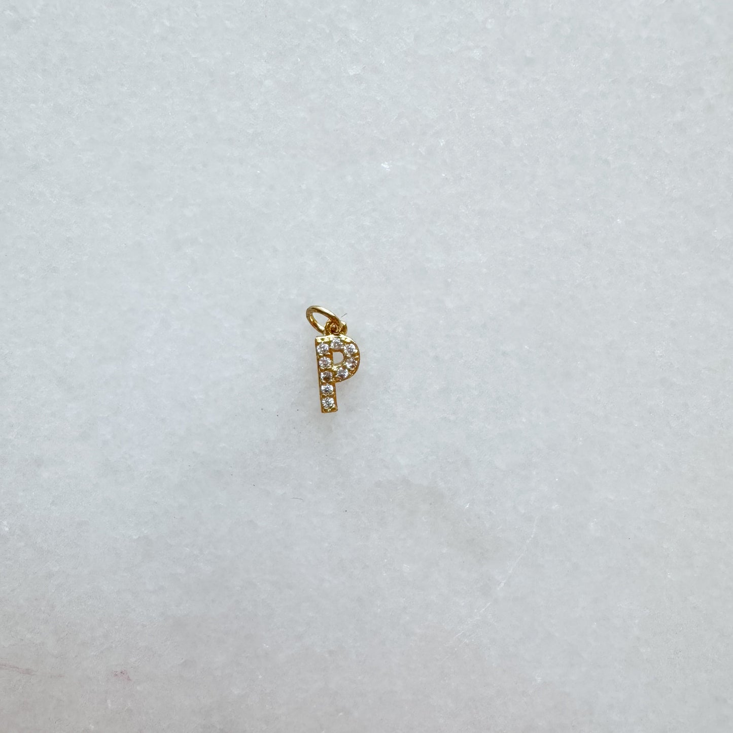 Diamond pavé initial charm set in gold, letter P