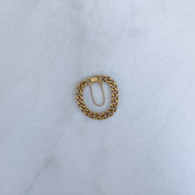 Load image into Gallery viewer, Gold chain bracelet on a light blue fabric background
