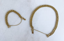 Load image into Gallery viewer, Set of 18K gold-plated 10mm cuban link chain and bracelet on marble background
