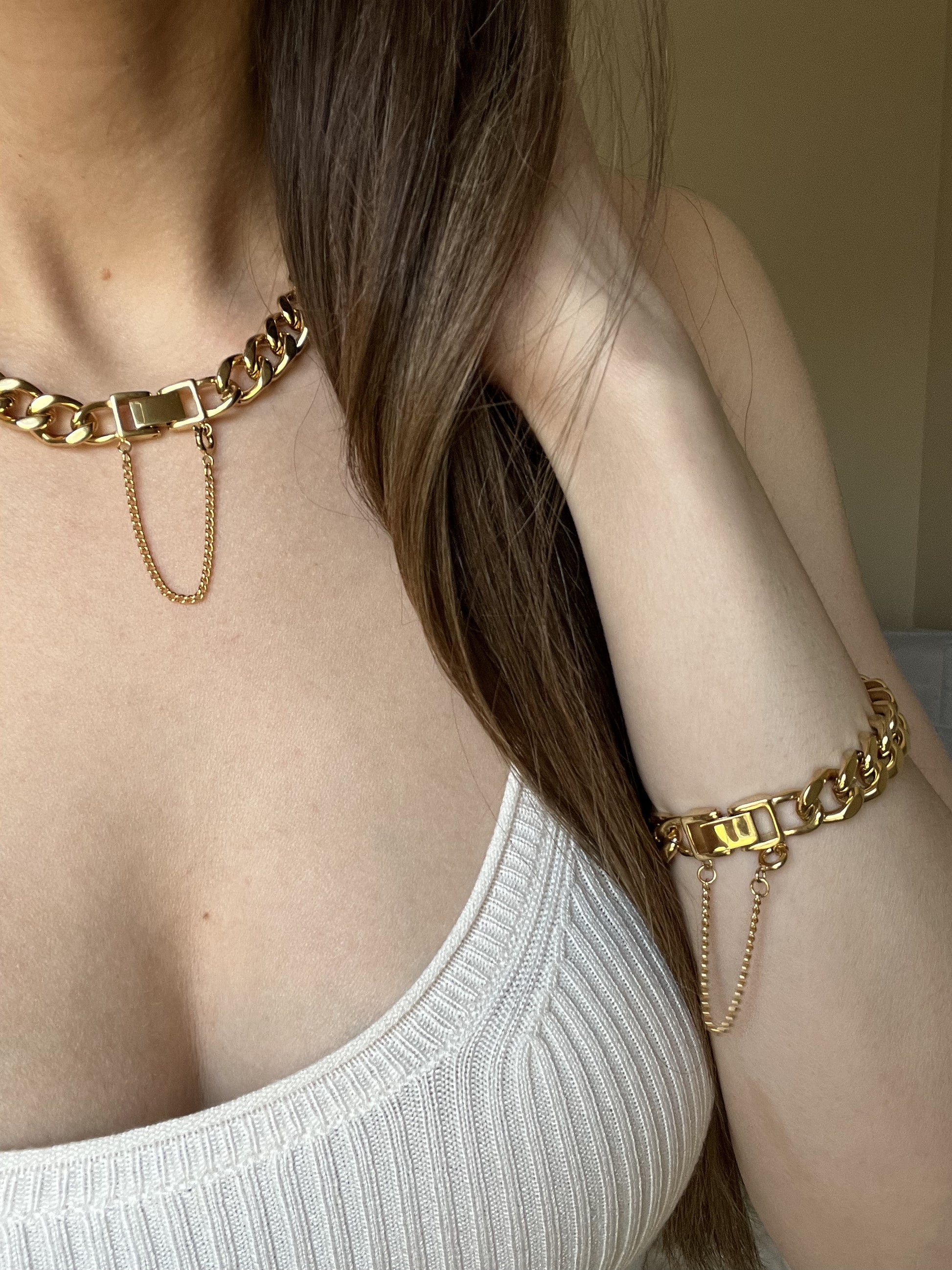 Woman wearing matching set of 18K gold-plated 10mm Cuban Link Chain and Bracelet