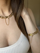 Load image into Gallery viewer, Woman wearing matching set of 18K gold-plated 10mm Cuban Link Chain and Bracelet
