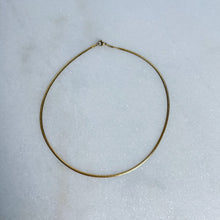 Load image into Gallery viewer, Gold herringbone necklace on a light gray background
