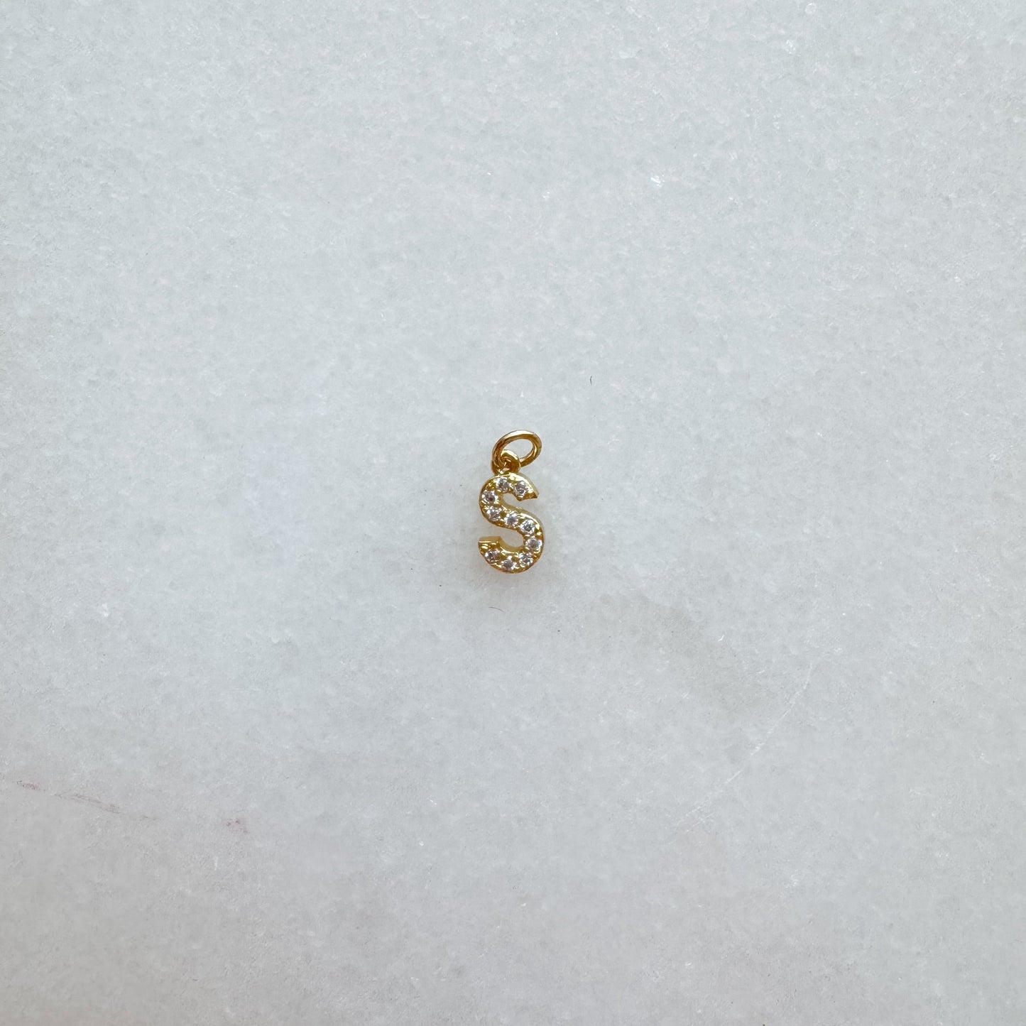 Diamond pavé initial charm set in gold, letter S
