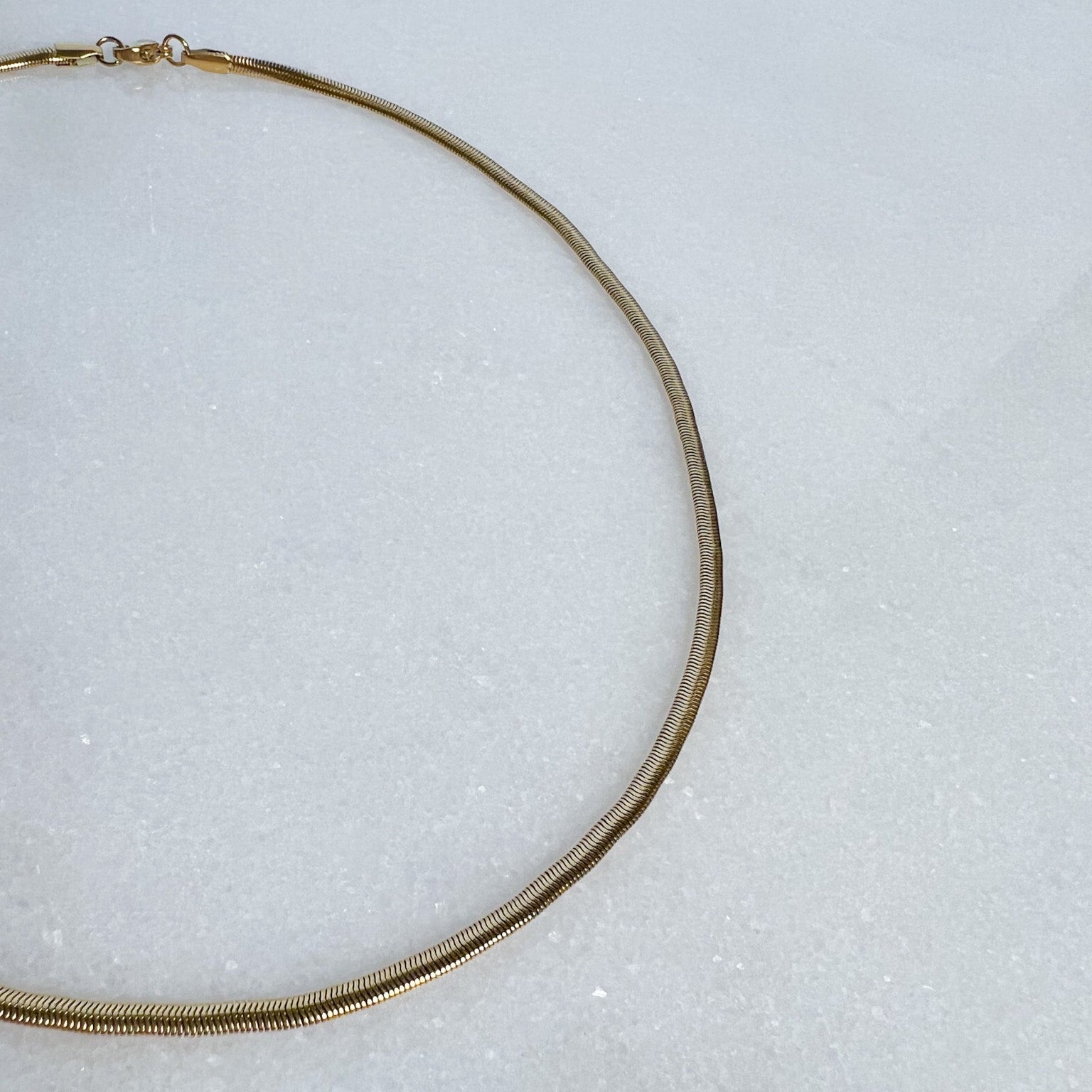 3mm Snake Chain on marble background
