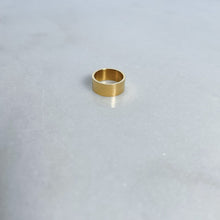 Load image into Gallery viewer, Gold band ring on a light gray background
