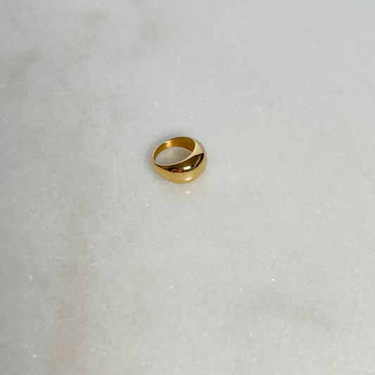 Gold Bubble Ring on marble background