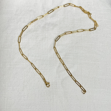 Load image into Gallery viewer, Gold Paperclip Necklace on white linen background.
