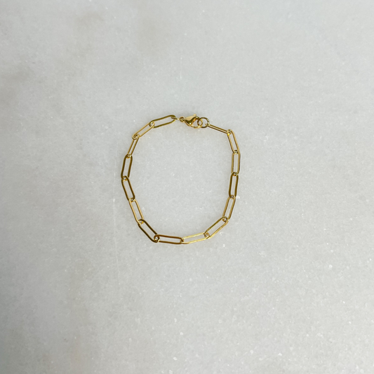 Gold Paperclip Bracelet on marble background