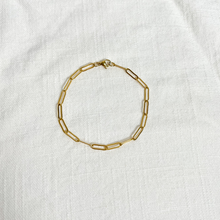 Load image into Gallery viewer, Gold Paperclip Bracelet on white linen background
