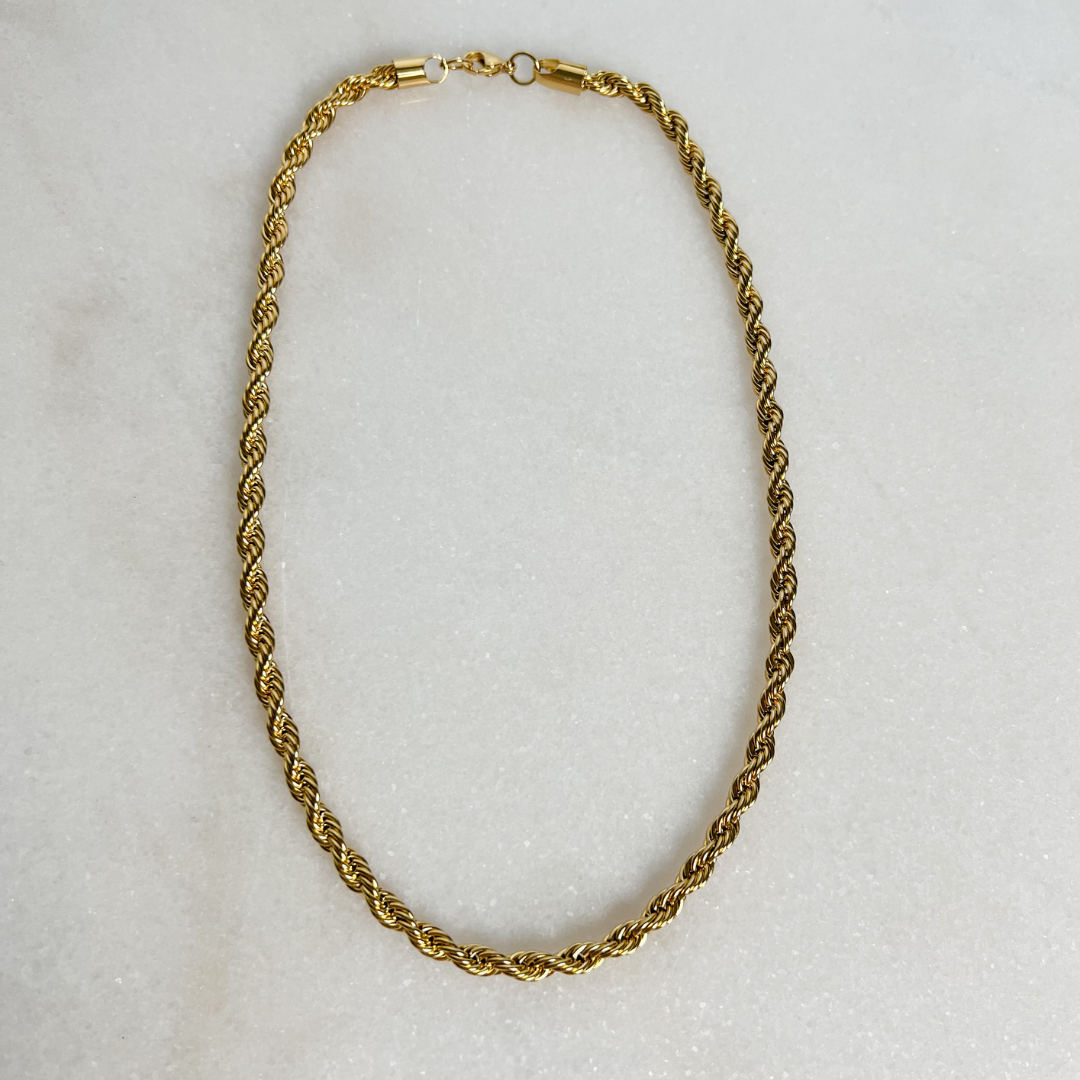 5mm Gold Rope Chain Necklace on marble background.