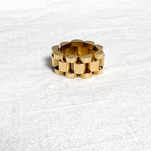 Load image into Gallery viewer, Gold watch link ring on white linen background
