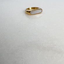 Load image into Gallery viewer, Gold signet ring with white enamel on marble background

