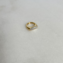 Load image into Gallery viewer, Gold signet ring with white enamel on marble background
